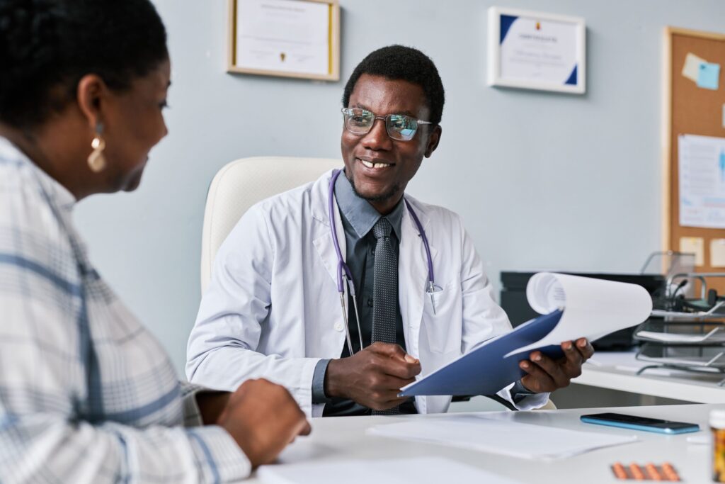 smiling black doctor consulting female doctor in c 2023 01 31 18 10 19 utc min scaled 1
